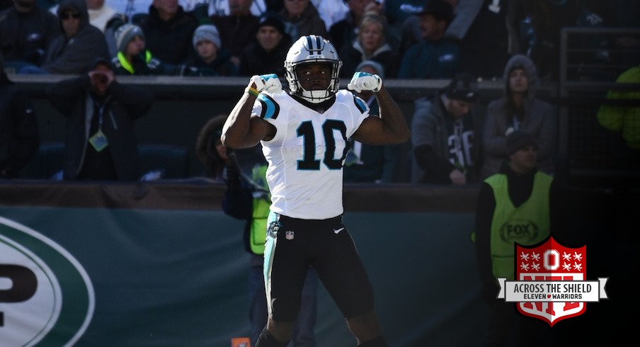 Curtis Samuel flexes after scoring a touchdown.