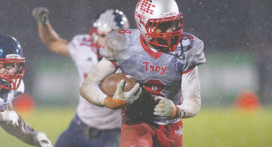 Troy running back Jayden Culp Bishop gets away from Piqua defenders