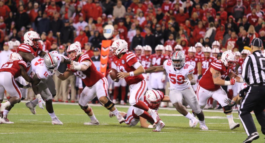 The Rushmen collapse on Nebraska's quarterback. 