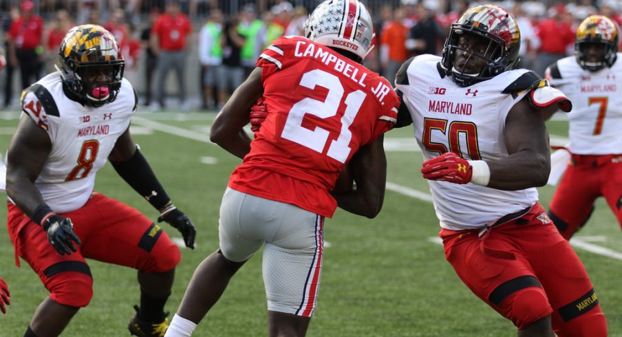 Parris Campbell attempts to break free of some nasty Terrapins. 