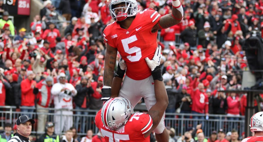 Mike Weber celebrates with Thayer Munford