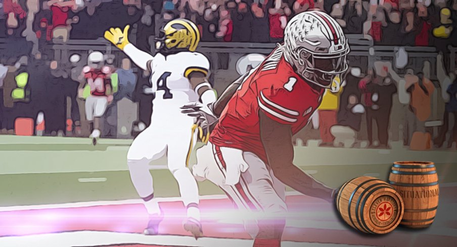 Nov 24, 2018; Columbus, OH, USA; Ohio State Buckeyes wide receiver Johnnie Dixon (1) scores a touchdown as Michigan Wolverines defensive back Josh Metellus (14) gestures to the officials at Ohio Stadium. Mandatory Credit: Greg Bartram-USA TODAY Sports