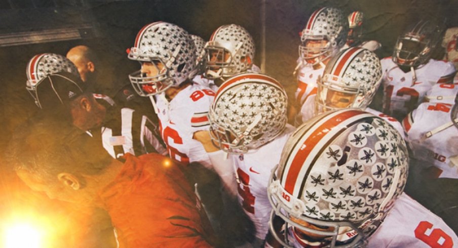 urban meyer leads the buckeyes onto the field for the 2013 B1G championship game