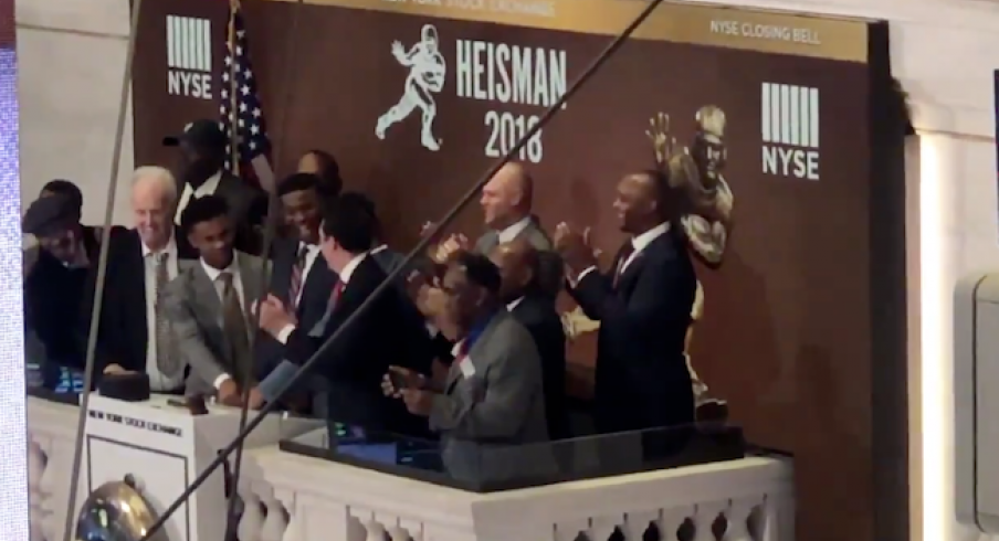 Dwayne Haskins helps ring the bell at the New York stock exchange.
