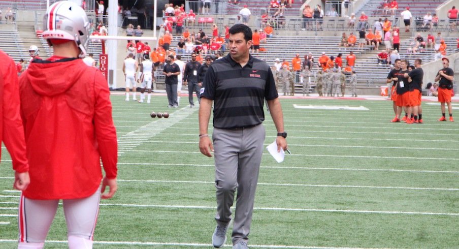 Ryan Day coaching quarterbacks during pregame warmups.