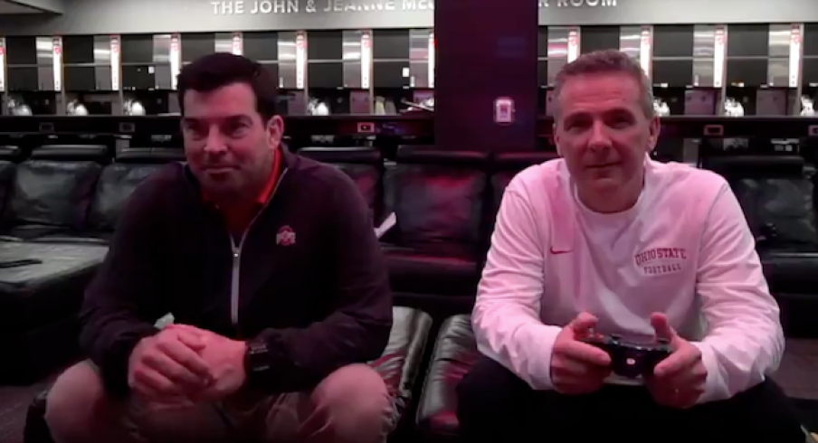 watch urban meyer pass the controller to ryan day signaling a