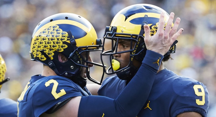 Nov 3, 2018; Ann Arbor, MI, USA; Michigan Wolverines wide receiver Donovan Peoples-Jones (9) receives congratulations from quarterback Shea Patterson (2) after he scores a touchdown in the first half against the Penn State Nittany Lions at Michigan Stadium. Mandatory Credit: Rick Osentoski-USA TODAY Sports