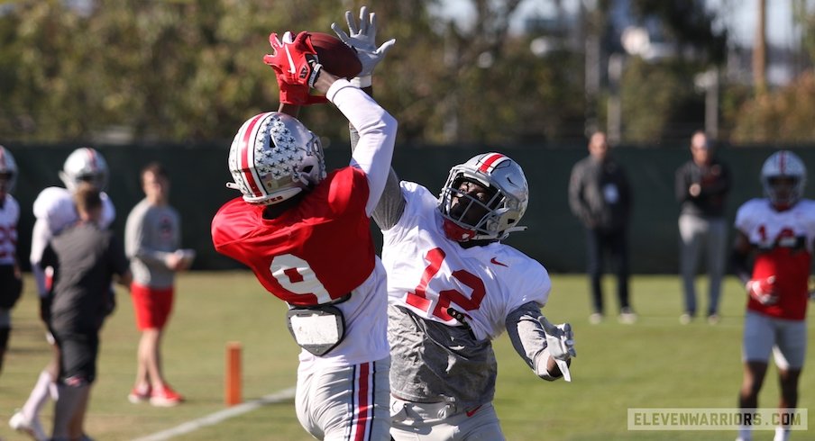 Binjimen Victor catches a touchdown pass over Sevyn Banks