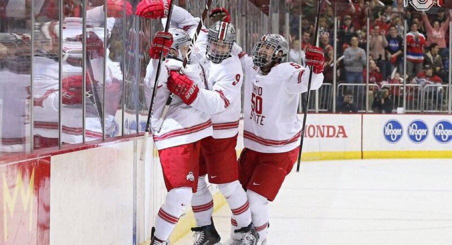 Tanner Laczynski and Matt Miller celebrate a goal in the Buckeyes' win over Michigan.