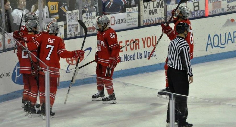 The men's hockey Buckeyes celebrate a goal in a 6-4 win over the Penn State Nittany Lions