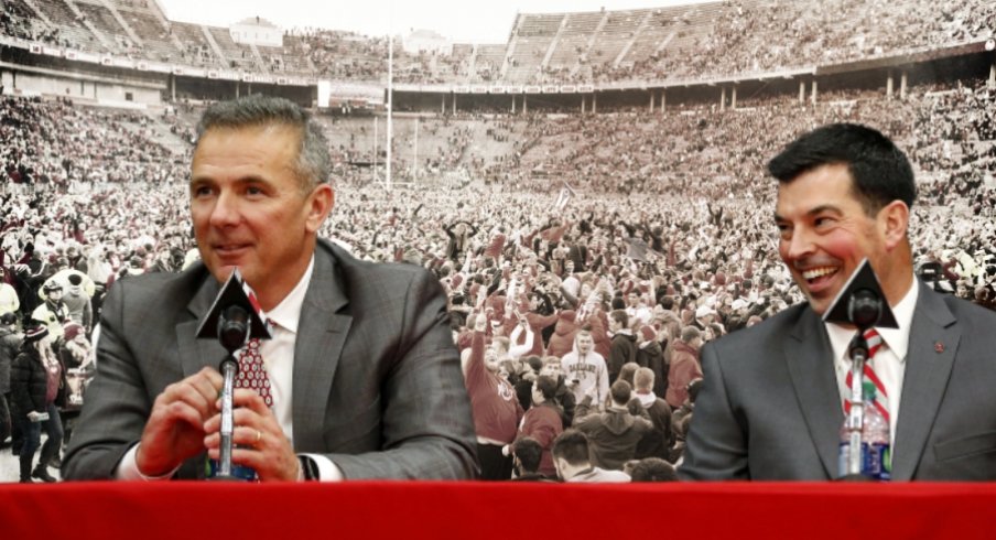 Nov 24, 2018; Columbus, OH, USA; Ohio State Buckeyes fans swarm the field after a victory over the Michigan Wolverines at Ohio Stadium. Mandatory Credit: Greg Bartram-USAT Sports | Dec 4, 2018; Columbus, OH, USA; Ohio State Buckeyes head coach Urban Meyer (left) addresses members of the media to announce his intentions to step down from coaching after the Rose Bowl game. Meyer is pictured with newly named head coach Ryan Day during the press conference at the OSU Fawcett Center. Joe Maiorana-USAT Sports