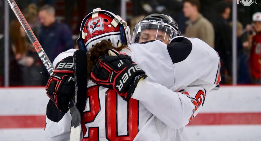 It is possible Andrea Braendli has mistaken Lauren Boyle for a puck in need of stopping. Or it's a hug.