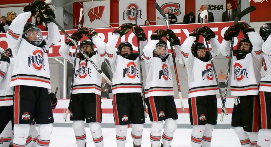 The women's hockey Buckeyes celebrate a home win.