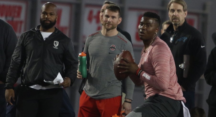 Quincy Avery (left) watches Dwayne Haskins throw at Ohio State's pro day.
