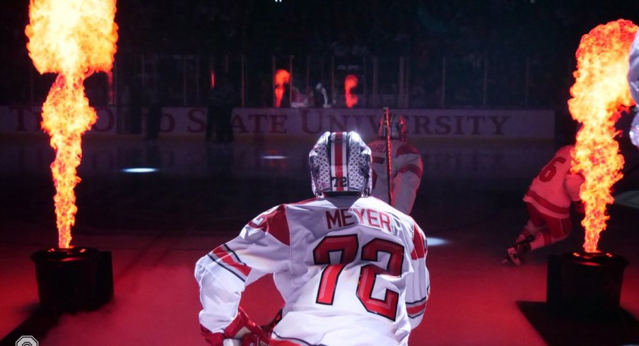 Columbus Blue Jackets prospect Carson Meyer leads the Buckeyes onto the ice.