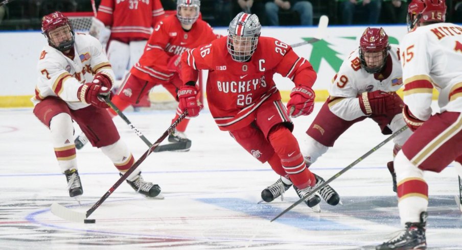 Buckeye captain Mason Jobst splits the Denver defense in the West Regional of the 2019 NCAA men's hockey tournament.