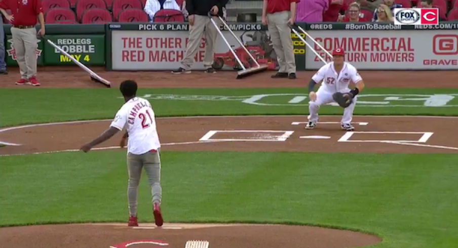 Parris Campbell tosses the opening pitch of the Reds vs. Marlins game.