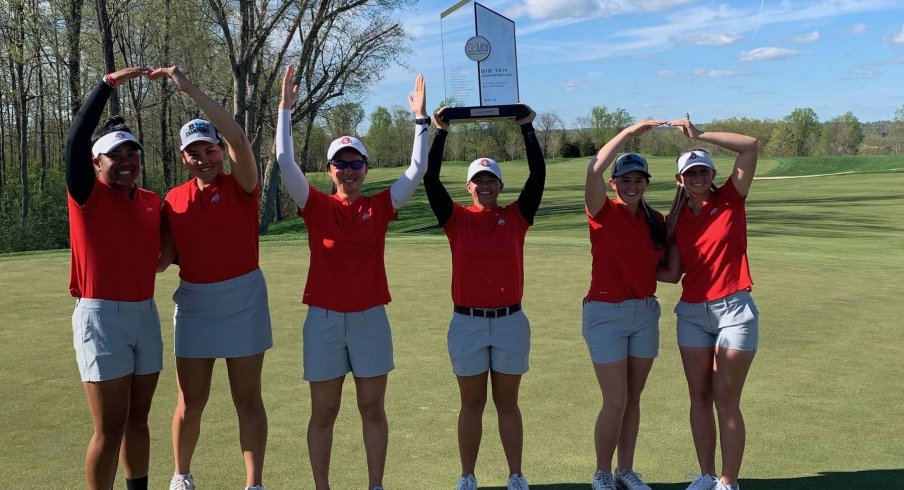 Women's golf celebrates its Big Ten title. 