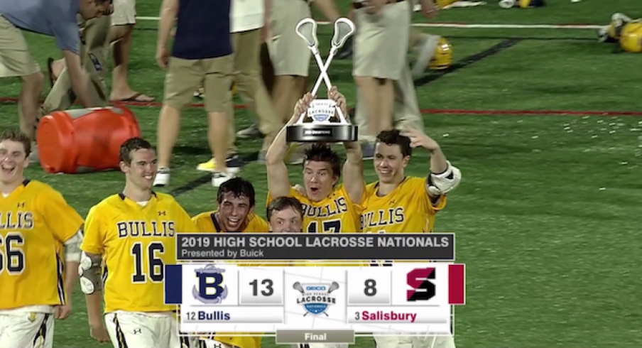 Bryson Shaw holding up the trophy.