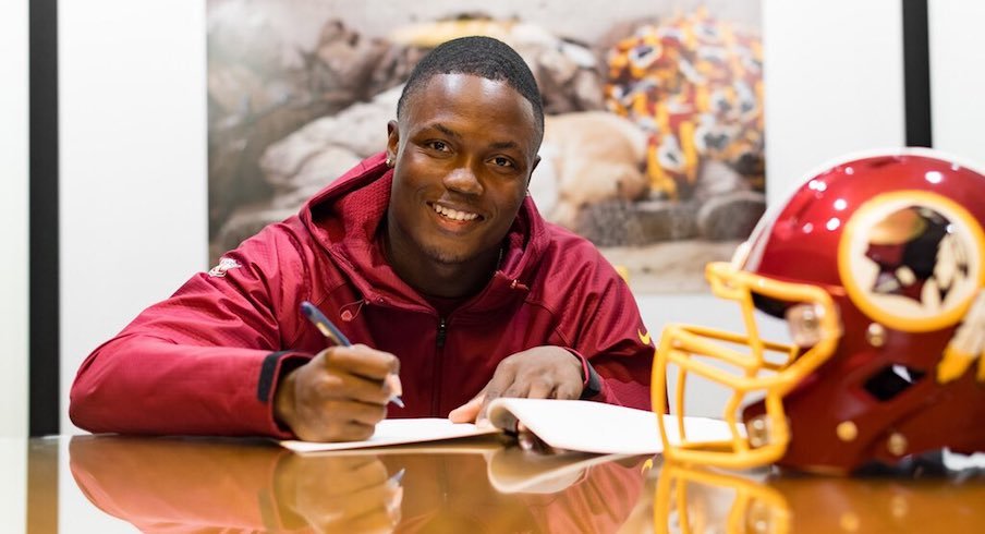 Terry McLaurin signs his NFL contract.