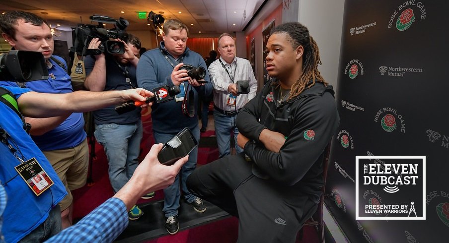 Ohio State defensive lineman Chase Young, surrounded by reporters
