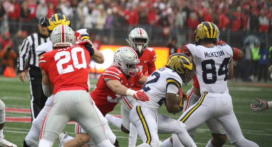 Borland takes down a Michigan ballcarrier. 