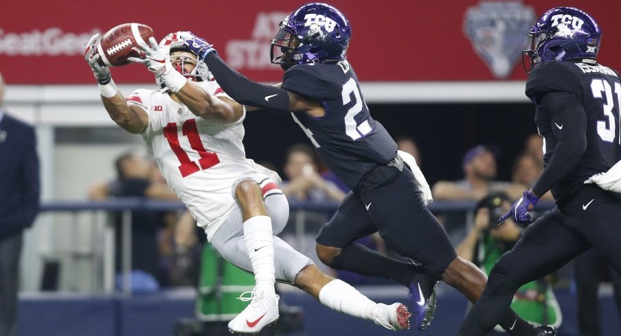 Austin Mack stretches out against TCU. 