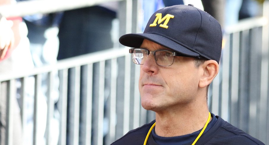 Jim Harbaugh takes a swipe at Urban Meyer