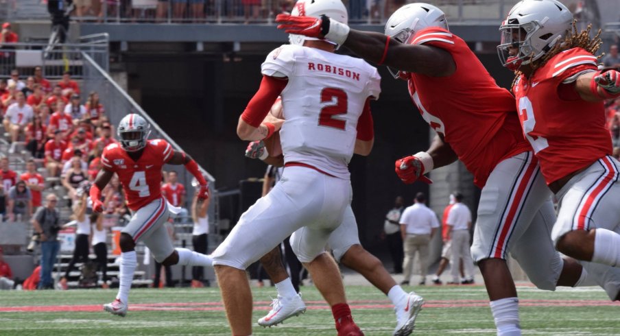 Jashon Cornell and Chase Young get to the quarterback. 