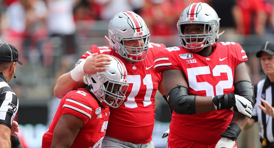 J.K. Dobbins, Josh Myers and Wyatt Davis