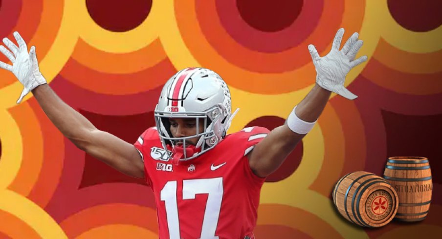 Sep 21, 2019; Columbus, OH, USA; Ohio State Buckeyes wide receiver Chris Olave (17) scores a touchdown as he is lifted by Ohio State Buckeyes offensive lineman Thayer Munford (75) during the first half against the Miami (Oh) Redhawks at Ohio Stadium. Mand