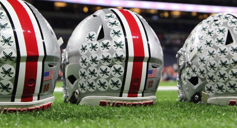 Row of helmets with Buckeye Leaves