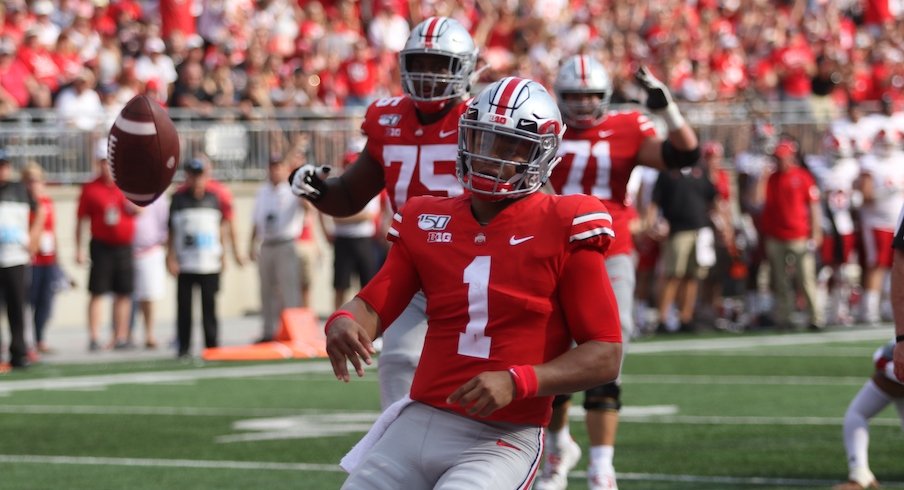 Justin Fields celebrates after running for a touchdown.