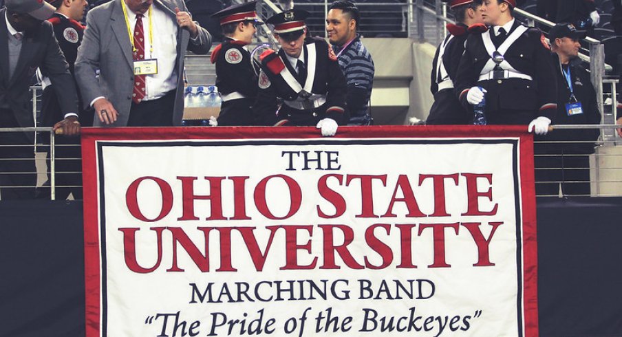 Members set up the Marching Band banner.