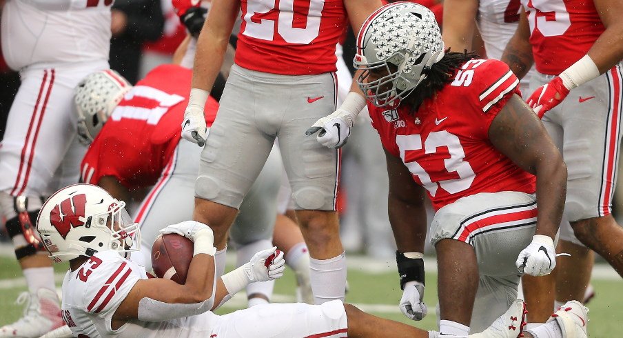 Wisconsin's Jonathan Taylor gets tackled