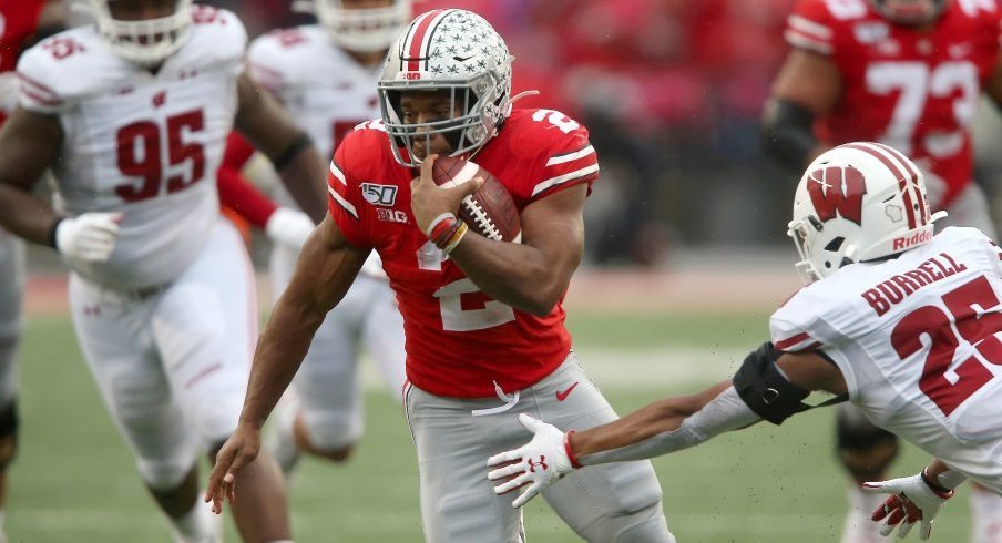 J.K. Dobbins tallied 221 total yards and two touchdowns in Ohio State's win over Wisconsin, dwarfing Jonathan Taylor's production.