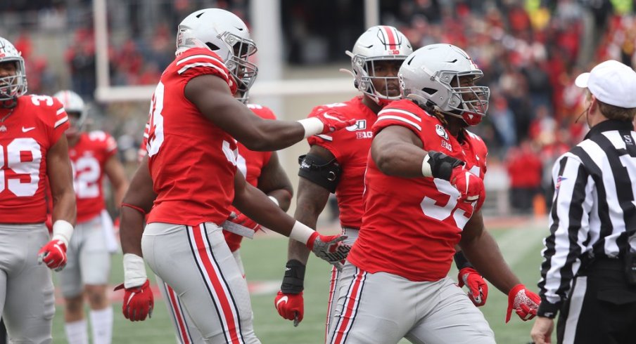 The defensive line celebrates a big play. 