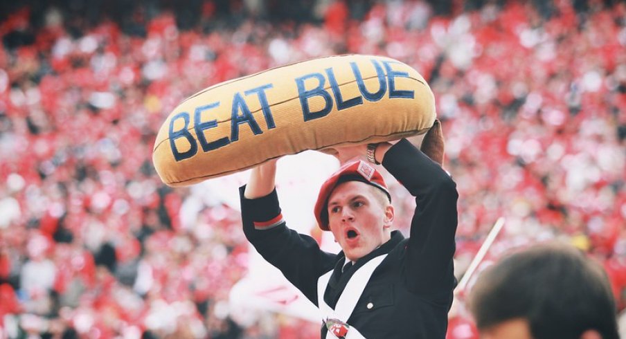 Band member holds the beat blue banana.