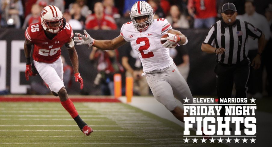 Dec 2, 2017; Indianapolis, IN, USA; Ohio State Buckeyes running back J.K. Dobbins (2) attempts to stay in bounds as he is chased by Wisconsin Badgers cornerback Derrick Tindal (25) in the third quarter in the Big Ten championship game at Lucas Oil Stadium. Mandatory Credit: Mark Hoffman/Milwaukee Journal Sentinel via USA TODAY Sports