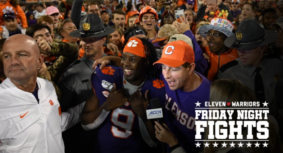 Nov 2, 2019; Clemson, SC, USA; Clemson Tigers head coach Dabo Swinney and running back Travis Etienne (9) talk with an ACC network reporter after defeating the Wofford Terriers at Clemson Memorial Stadium. Mandatory Credit: Adam Hagy-USA TODAY Sports