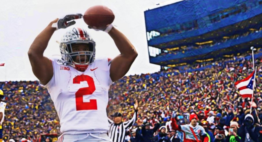 Nov 30, 2019; Ann Arbor, MI, USA; Ohio State Buckeyes running back J.K. Dobbins (2) celebrates after he scores a touchdown in the first half against the Michigan Wolverines at Michigan Stadium. Mandatory Credit: Rick Osentoski-USA TODAY Sports