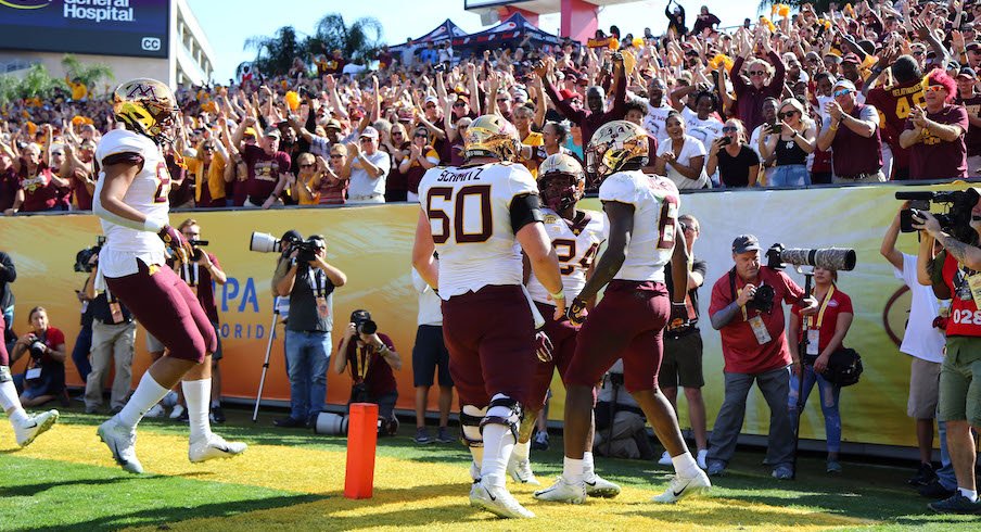 Minnesota players and fans celebrate a touchdown.