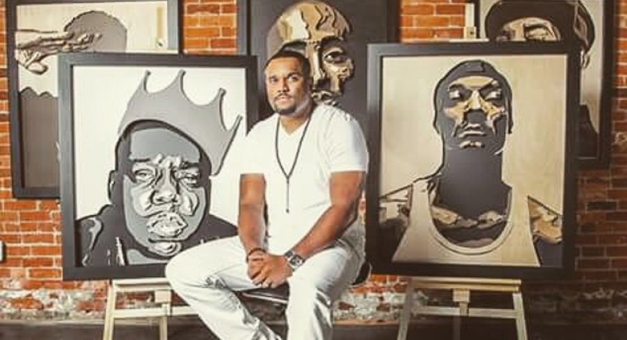 Percy King with a few of his art pieces.