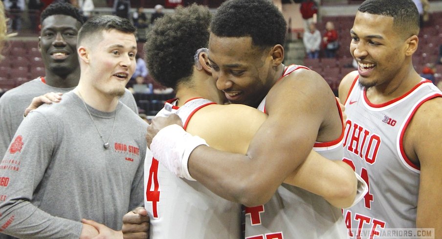 Andre Wesson hugs Duane Washington Jr. on Senior Night.