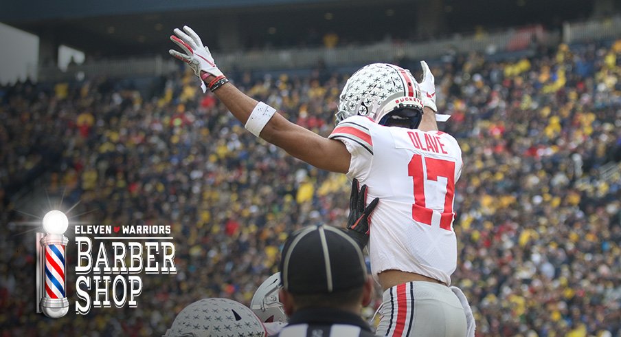 Chris Olave celebrates at Michigan Stadium.