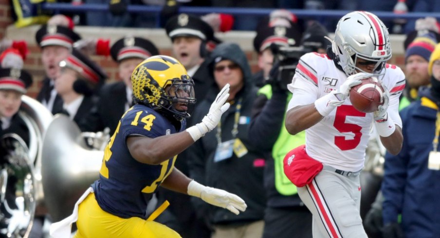 Ohio State Buckeyes receiver Garrett Wilson catches a touchdown pass over Michigan Wolverines safety Josh Metellus during the second half at Michigan Stadium in Ann Arbor, Saturday, Nov. 30, 2019. Sad Michigan football