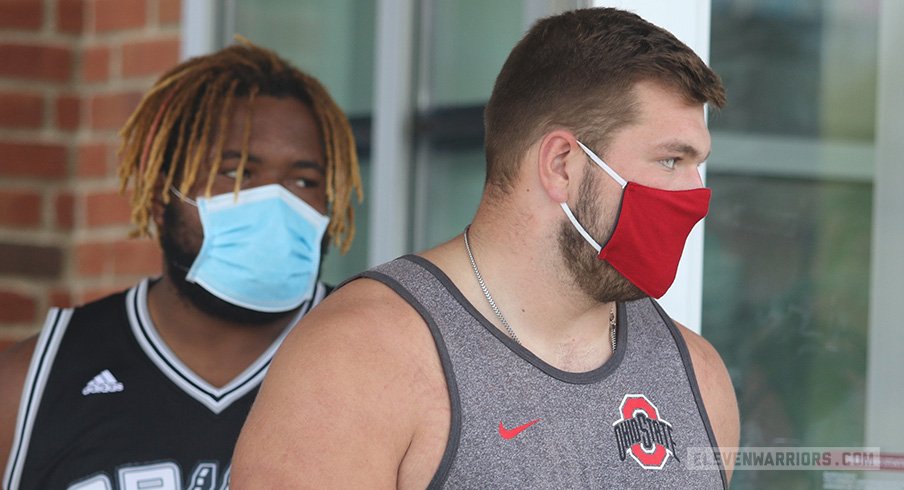 Wyatt Davis and Josh Myers exit the Woody Hayes Athletic Center after the Big Ten canceled fall football.