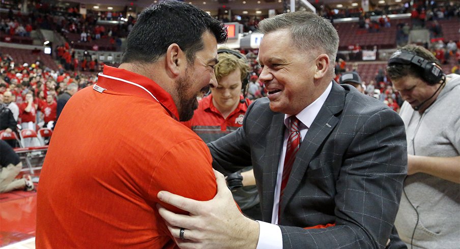 Ohio State football coach Ryan Day embracing Ohio State basketball coach Chris Holtmann