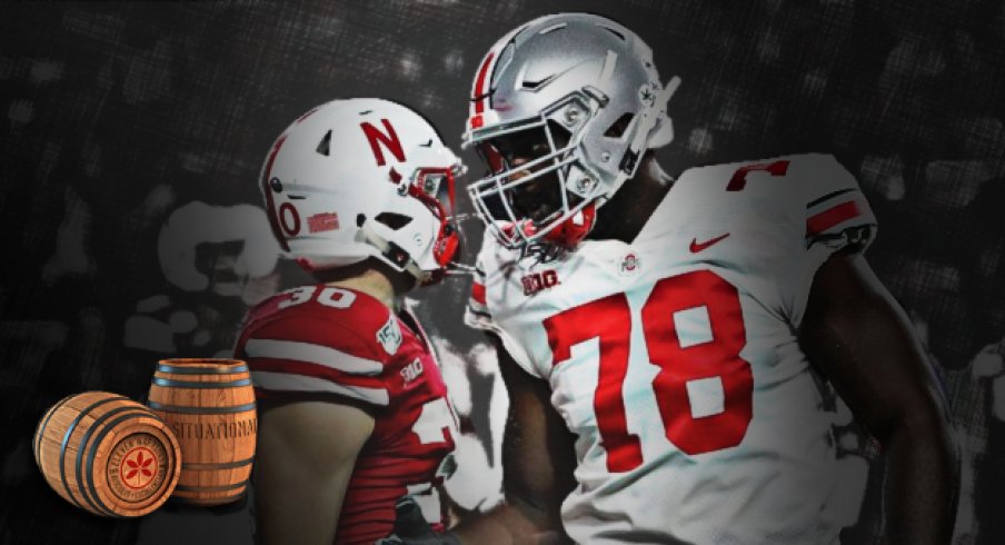 Ohio State tackle Nicholas Petit-Frere greets Nebraska safety Eli Sullivan