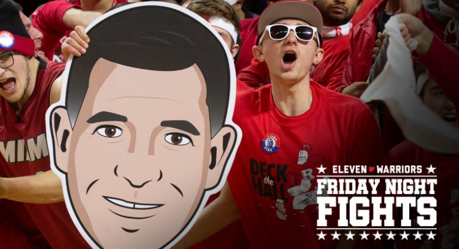 Rutgers fans hold up a Greg Schiano face as they cheer on their team. Seton Hall Basketball at Rutgers in Piscataway, NJ on 12/12/19